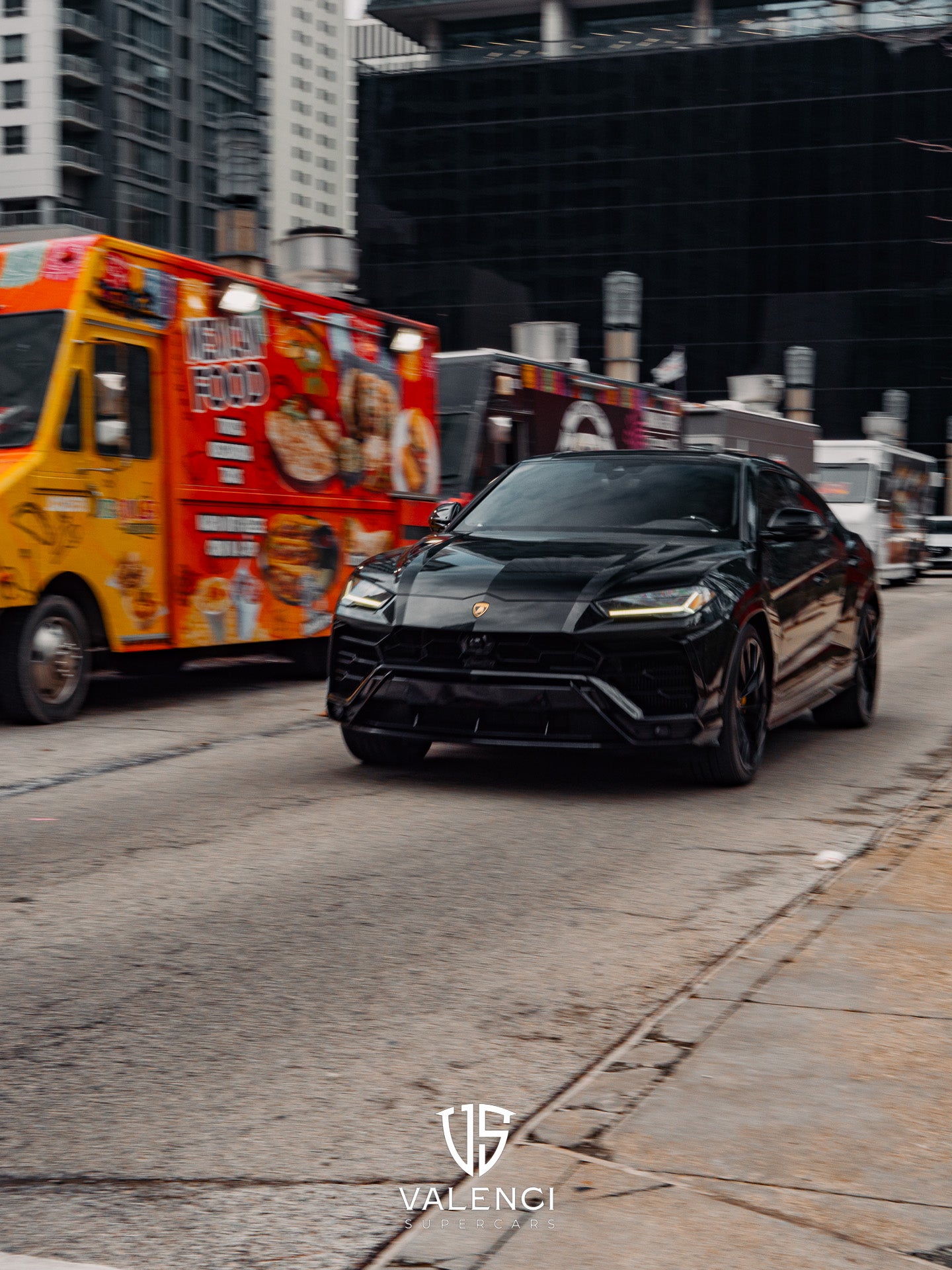 Lamborghini Urus front view showcasing bold black grille, sleek headlights, and aggressive luxury SUV design.