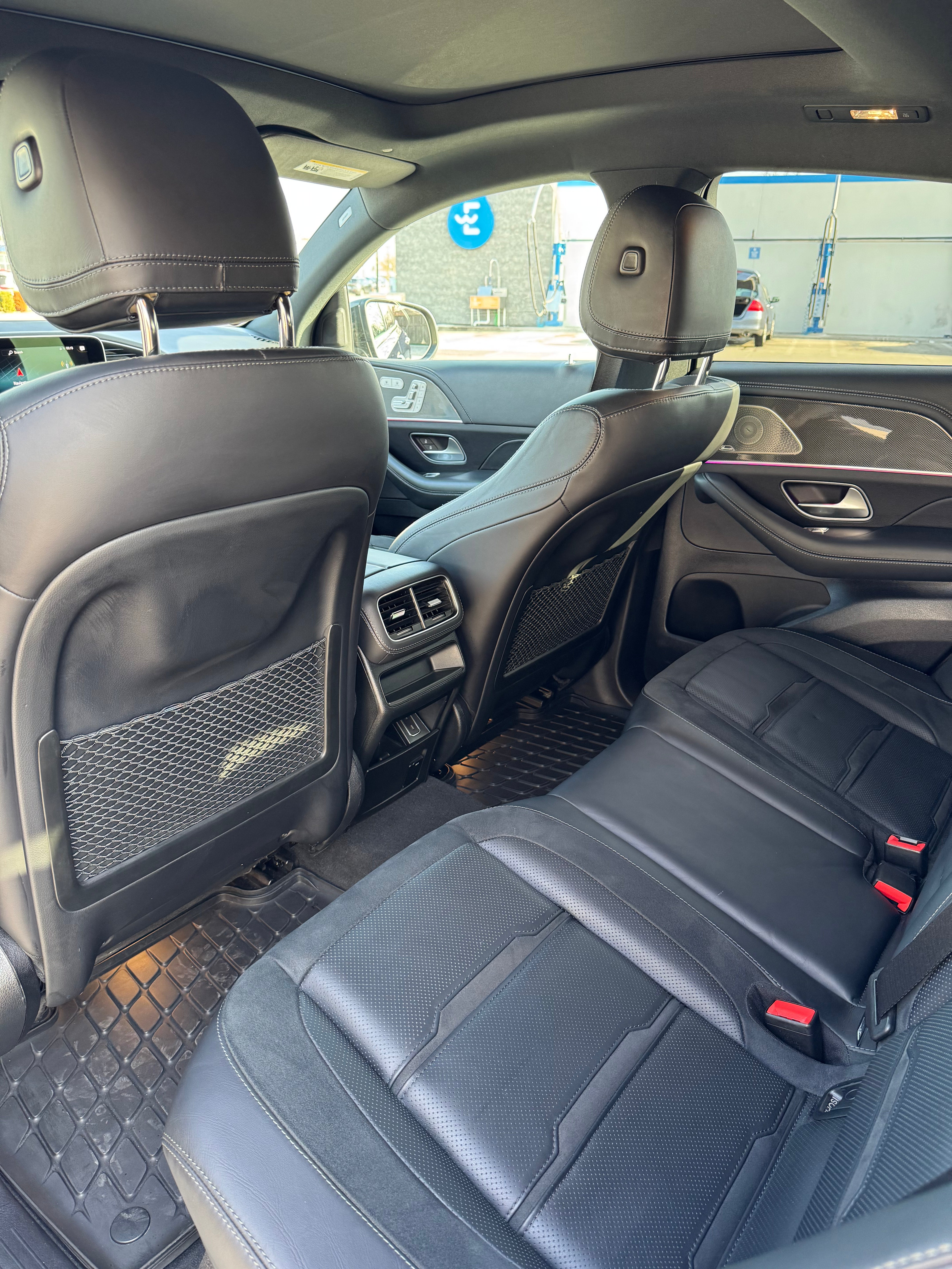 Mercedes-AMG GLE 53 back seats showcasing premium leather upholstery, spacious design, and advanced comfort features for passengers.